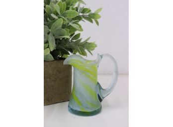 Curvaceous Mini Hand Blown Glass Pitcher With White And Yellow Swirls