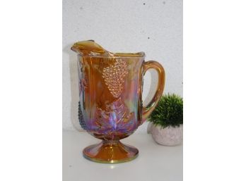 Vintage Iridescent Amber Carnival Glass Pitcher In Harvest Grape Pattern.