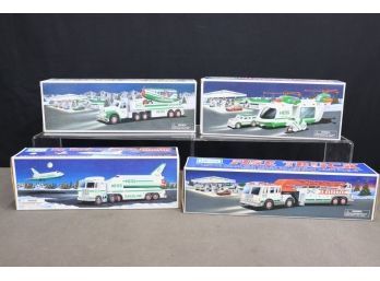 Group Of Four Collectible HESS Fire Truck And Truck/Trailer Sets In Original Box