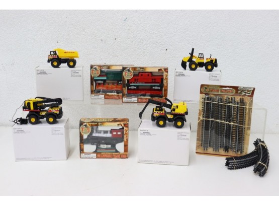 Group Lot Of Collectible Train Cars, Maisto/Tonka Heavy Equipment Minis, And T And S Train Tracks Set
