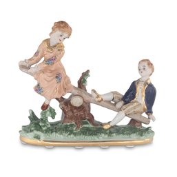 Boy And Girl Porcelain Figurine