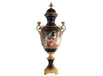 A Renaissance Of Craftsmanship: Blue Vase With Bronze Cherub Handles And Classical Scenes.