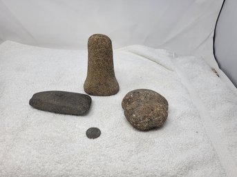 Three Ancient Stone Pestles And A Nutting Stone