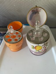 Two Antique Egg Form Painted Glass Decanters Caddies