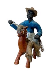 Black Cowboy Sculpture On Horse Wrangling Coyote