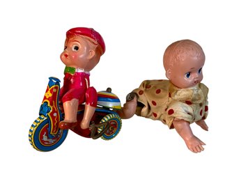 Two Early Friction Toys Plastic Babies