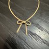 Avon Gold Tone Bow Necklace