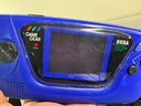 Box Of Electronics With Vintage Sega Game Gear And Other Video Game Items