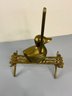 Brass Duck On A Bench With An Umbrella