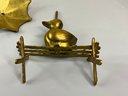 Brass Duck On A Bench With An Umbrella