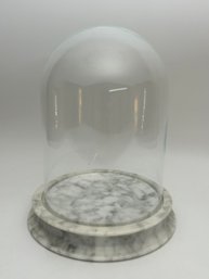 Glass Dome Display On White Marble Stand