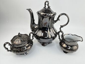 Teapot, Sugar Bowl And Milk Pitcher (Dipped Silver-plate Over Ceramic)