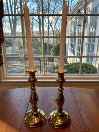 Pair Of 11' Gold Tone Weighted Candle Stick Holders With Candles