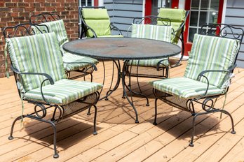 Wrought Iron Round Table With Four Cushioned Chairs