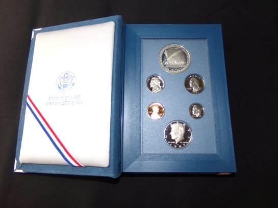 1986 Prestice Set With Dollar In Original Box With COA (90 Silver)