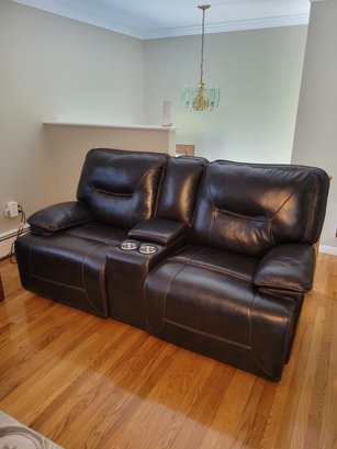 Brown Leather Reclining LoveSeat.  Power Recline And USP Ports On Both Ends.