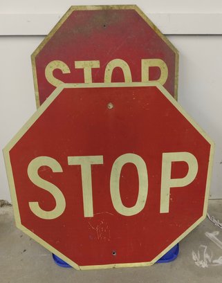 Two Metal Stop Signs
