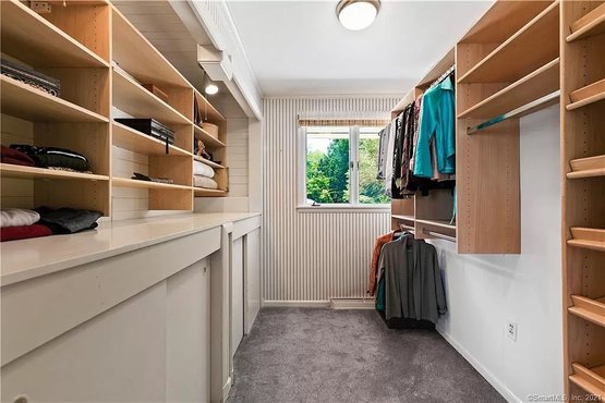 A Wood Built In Storage System - Linen Closet
