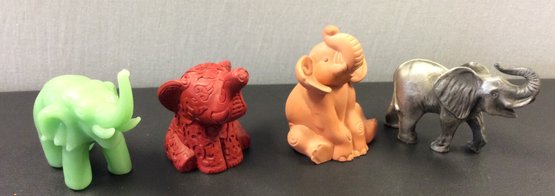 A Group Of Four Handcrafted Elephants Figurine  Two By PG