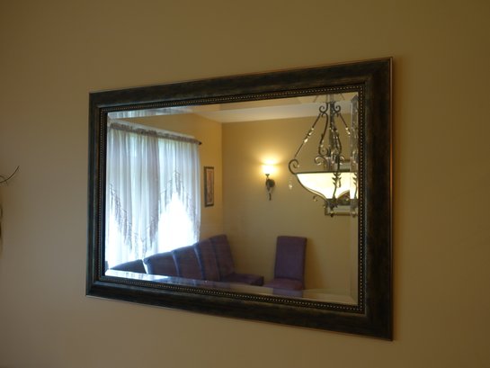Hanging Mirror In A Graceful Metal Frame