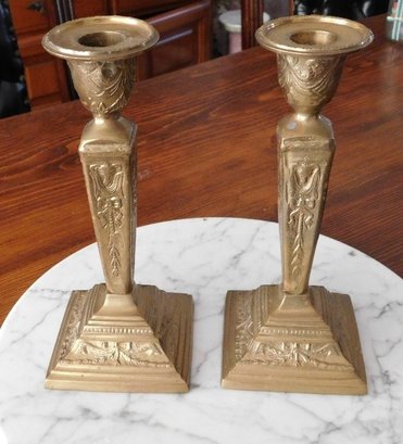 A Pair Of Victorian Styled Brass Candlesticks