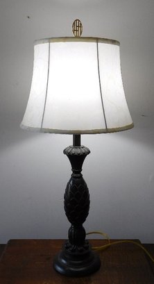 A Black Finished Pineapple Table Lamp With Cloth Shade
