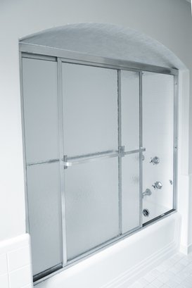 A Pair Of Rippled Glass Doors Shower Enclosure