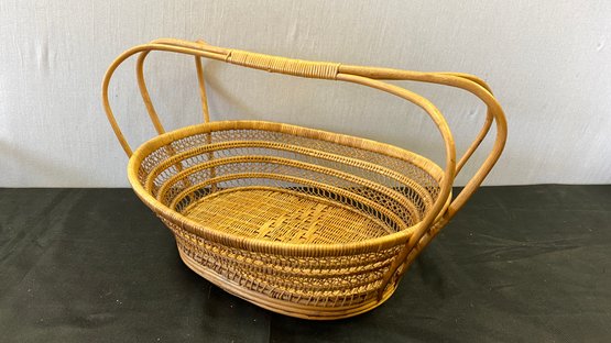 A Vintage Hand Woven Decorative Basket With Handle.