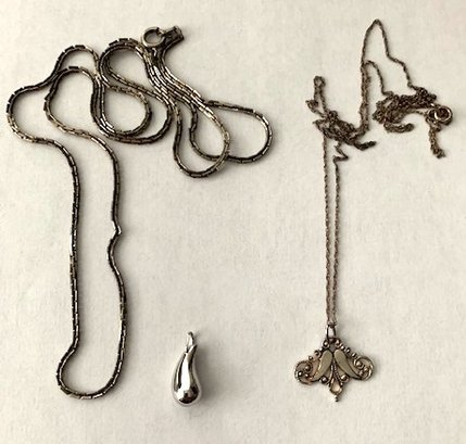 Two Silver-Tone Necklaces And Pendants