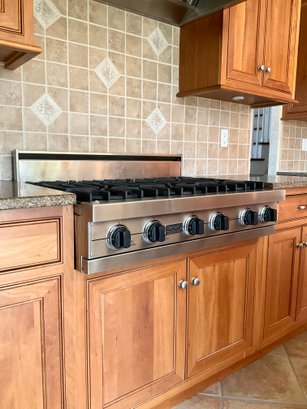 A Viking 36 Inch Pro-Style Gas Range Top With 6 Open Burners With Vari-Simmer