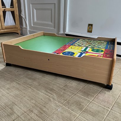 A Wheeled Storage And Play Table