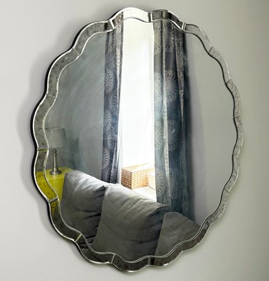 A Glam Serpentine Form Mirror Framed Mirror