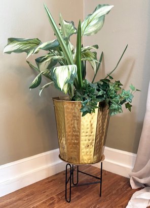 A Modern Brass Planter With Faux Greenery On Wrought Iron Stand