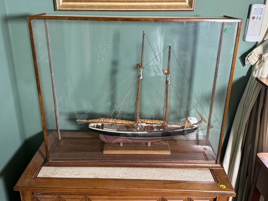 AN ANTIQUE CASED SAILBOAT