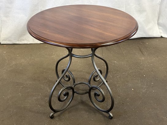 A Stylish Side Table With A Mahogany Top & Scrolled Metal Base