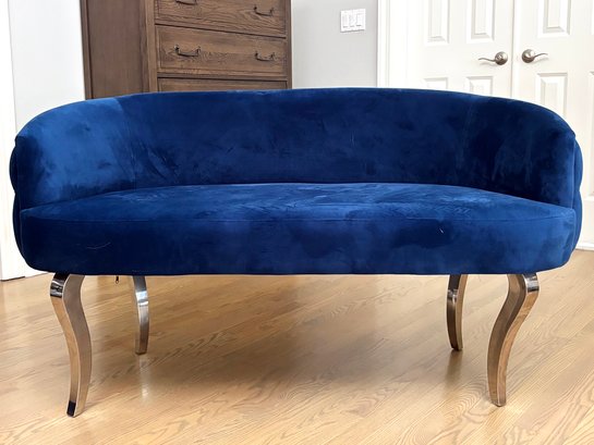 A Glam Tufted Loveseat In Velvet With Chrome Buttons