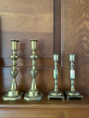 Two Pairs Of Brass Candle Holders.