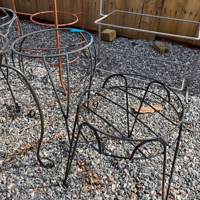 A Collection Of Metal Plant Stands