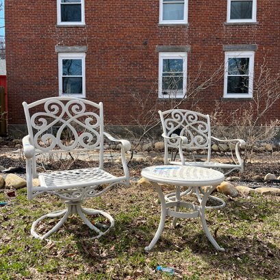 A Pair Of Aluminum Swivel And Rock Chairs And Table