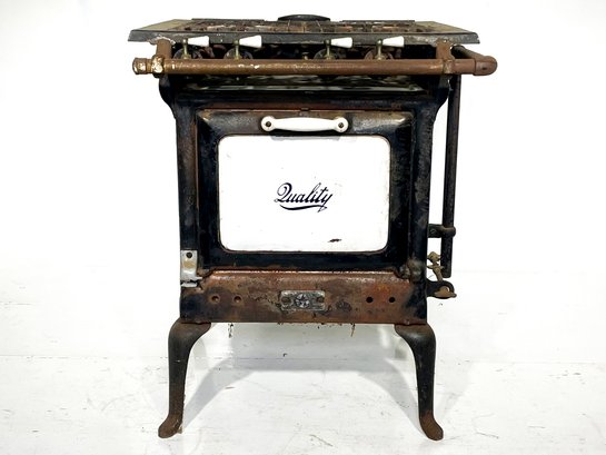 An Antique Cast Iron And Enamel Gas Stove 'Quality'