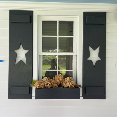 A Pair Of Wood Shutters With Window Box