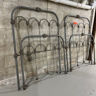 A Pair Of Distressed Vintage Wrought Iron Bed Frames