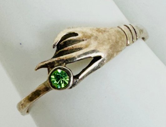 COOL STERLING SILVER HAND HOLDING GREEN CRYSTAL RING