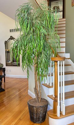 A Large Tropical Faux Palm Tree In Wicker Basket