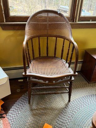 A VICTORIAN CANED BENTWOOD ARMCHAIR