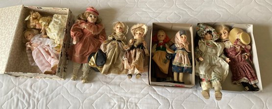 Three Porcelain And Six Plastic Dolls