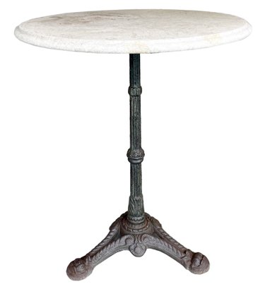 An Antique Cast Iron And Marble Bistro Table