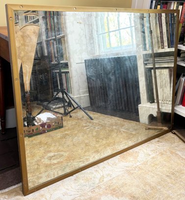 A Modern Brass Framed Mirror By Bassett