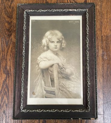 An Antique Photograph In Carved Wood Frame