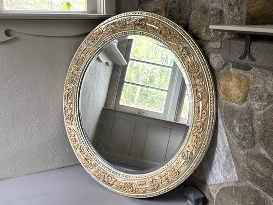 An Elegant Beveled Wall Mirror With A Carved Gilt Frame